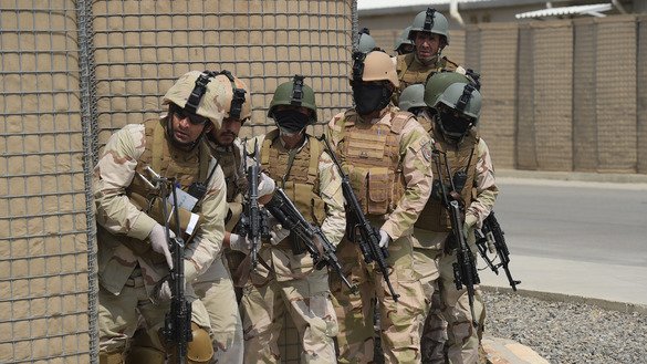 In this photograph taken on July 27, 2017, Afghan special forces perform a drill during exercises at their training centre in Kabul. [Shah Marai/AFP]