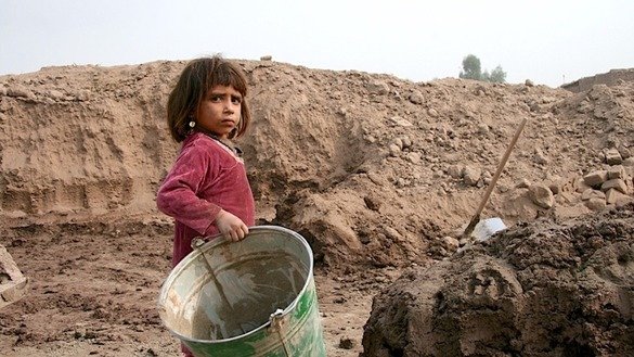 Shagofa, 5, helps her father, brothers and sisters in the brick factory. [Khalid Zerai]