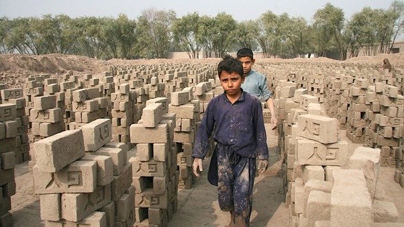 If the family makes 2,000 bricks per day, the factory owner provides them two rooms to sleep in. Still, they are unable to climb out of debt, says Abdur Raziq, 48, the patriarch of the family. [Khalid Zerai]