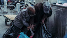A photo circulated widely on social media in the past month depicts two homeless men fighting over a bottle outside the Grand Bazaar in Tehran. Recent protests against the Iranian regime were sparked largely because of the country's deteriorating economic situation.