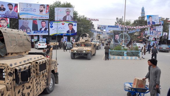 Afghan security forces vehicles cross Kunduz City Square in a show of force military manoeuvre on October 16. [Hedayatullah]