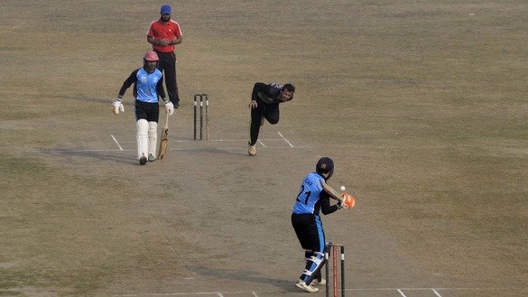 Afghan refugee players play cricket in Peshawar December 5. [Shahbaz Butt]