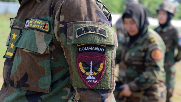 A military badge is pictured on the uniform of an Afghan woman army officer during a practice session in Chennai, India, December 19. [ARUN SANKAR/AFP]