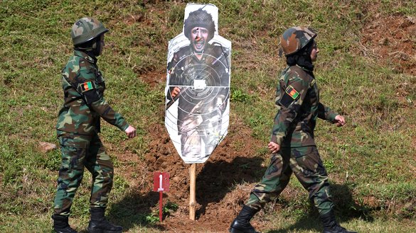 Afghan army cadets take part in a firing exercise during a training programme at the Officers Training Academy in Chennai on December 12. [Arun SANKAR / AFP]