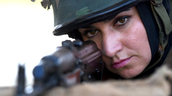 An Afghan army cadet aims at a target during a practice session at the Officers Training Academy in Chennai on December 12. [Arun SANKAR / AFP]