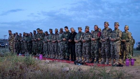 Afghan National Army officers, soldiers and local authorities participate in evening prayers in Guzara district, Herat province, last May 15. [Omar/Salaam Times]