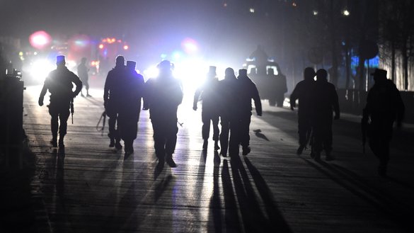 Afghan security personnel arrive at the site of twin blasts in Kabul January 10. [WAKIL KOHSAR/AFP]