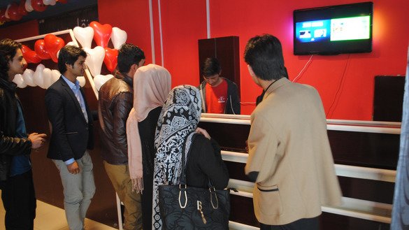 Customers stand in line for tickets March 24 at the family-oriented Galaxy Cinema in Kabul. [Sulaiman]
