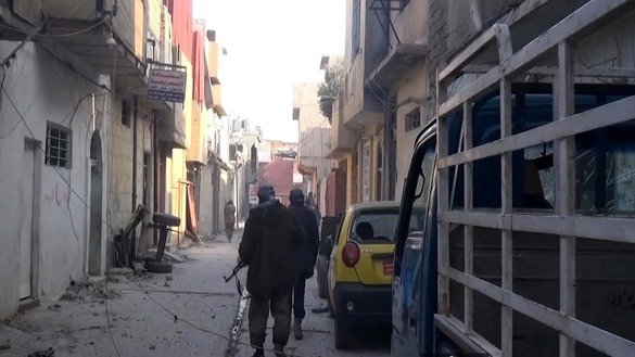 A screenshot taken from a video circulated online shows ISIL fighters in the old part of Mosul. Tensions have been emerging among ISIL fighters in the city as the group comes under fire, local officials say. [File]