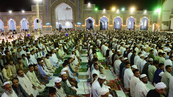 Afghan men pray June 7 in Mazar-e-Sharif during Ramadan. [Hoshang Hashimi/AFP]