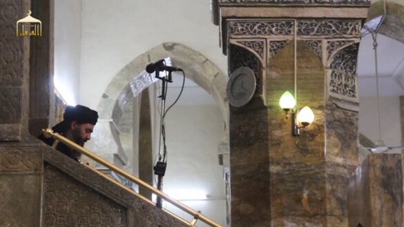 'Islamic State of Iraq and Syria' leader Abu Bakr al-Baghdadi descends from the pulpit of Mosul's al-Nuri mosque after announcing the creation of a 'caliphate' in this screen shot from a June 2014 video.