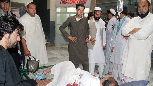 An injured Afghan receives treatment at a hospital following an explosion at a mobile phone market in Khost Province September 17. [Farid Zahir/AFP]