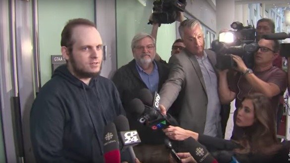 Freed hostage Joshua Boyle (left) told reporters in Toronto October 13 that during his family's captivity in Afghanistan, Haqqani Network operatives raped his wife and killed his infant daughter. The Taliban deny the accusations. [Screenshot from CBC News]
