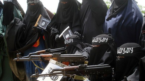 Female members of the 'Islamic State' al-Khansa brigade are pictured with rifles. [Photo courtesy of Mohammed al-Abdullah]