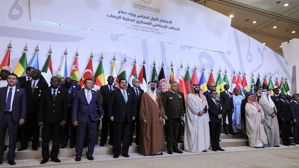 Saudi Prince and Defence Minister Mohammed bin Salman (6th from right) poses for a group picture with other defence ministers and officials of the 41-member Islamic Military Counter Terrorism Coalition November 26 in Riyadh. [Fayez Nureldine/AFP]