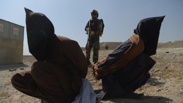 An Afghan National Army (ANA) commando guards hypothetical Taliban insurgents during an exercise at the Kabul Military Training Centre (KMTC) last October 17. ANA troops participated in the exercise to demonstrate their combat training to local and international media. [Shah Marai/AFP]