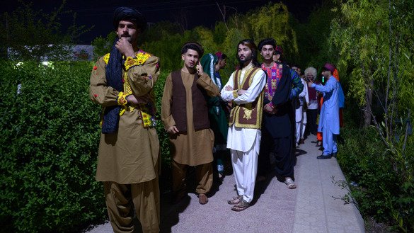 Afghan models prepare to go onstage during a fashion show April 10 in Mazar-e-Sharif. [Farshad Usyan/AFP]