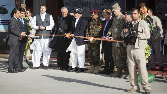 President Ashraf Ghani cuts a ribbon inaugurating the UH-60 Black Hawk helicopter into the AAF during a ceremony at Kandahar Airfield last October 7. [Staff Sgt. Benjamin Gonsier/US Air Force]