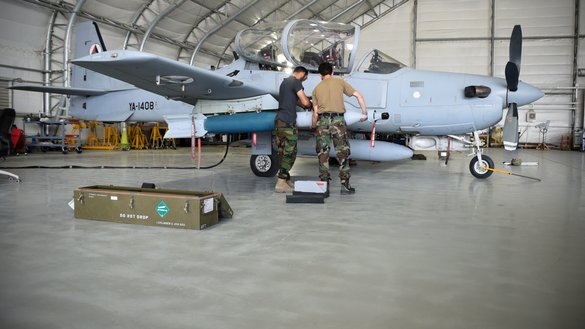 Two AAF A-29 Super Tucano maintainers download GBU-12s (Guided Bomb Units) at Kabul Air Wing July 26, 2017. [Tech. Sgt. Veronica Pierce/US Air Force]