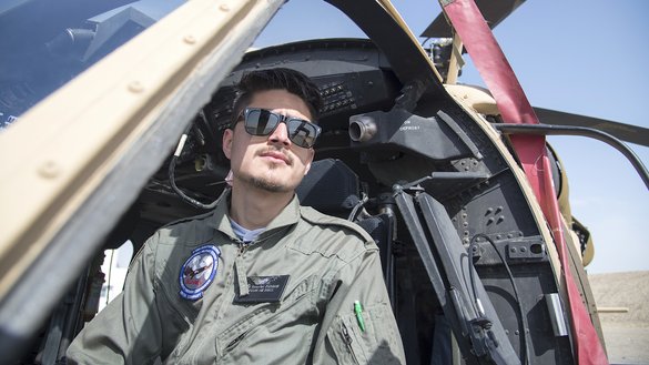 An AAF pilot sits inside a UH-60 February 18 at Kandahar Air Wing. [Staff Sgt. Jared J. Duhon/US Air Force]