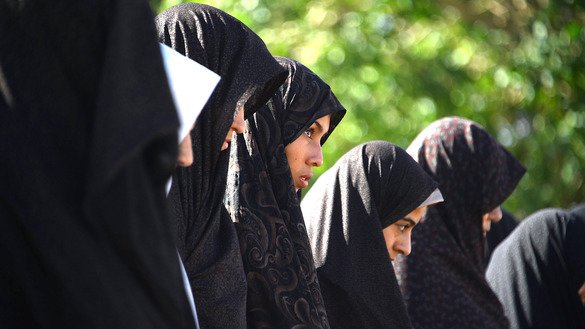 Women offer prayers at the start of Eid ul Fitr in Herat Province June 15. [Hoshang Hashimi/AFP]