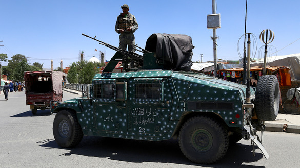 Afghan troops patrol Ghazni city August 14. [ZAKERIA HASHIMI/AFP]