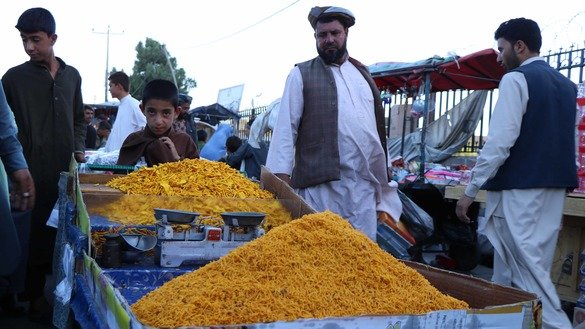 A boy in Herat August 19 sells dried fruits ahead of Eid ul Adha. [Nasir Salehi]
