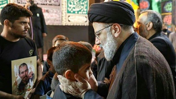 Seyyed Ebrahim Raisol-Sadati, commonly known as Ebrahim Raisi and the custodian and chairman of the Iranian charity Astan Quds Razavi, September 20 in Mashhad, Iran, meets with a number of children whose fathers were killed in Syria fighting for the Fatemiyoun Division. [File]
