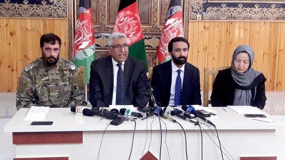 Herat provincial Governor Mohammad Asif Rahimi (2nd left), provincial Police Chief Gen. Aminullah Amarkhil (left) and officials from IEC and Independent Electoral Complaints Commission speak to the media regarding preparations for Saturday's elections October 18 in Herat city. [Nasir Salehi]