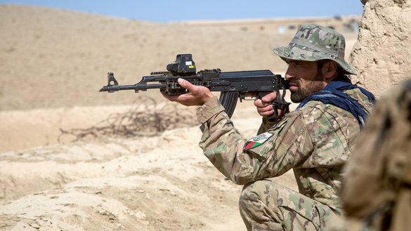 An Afghan special operator stands watch as Afghan special forces raid Taliban compounds in Baraki Barak District, Logar Province, October 10. [NATO courtesy photo]