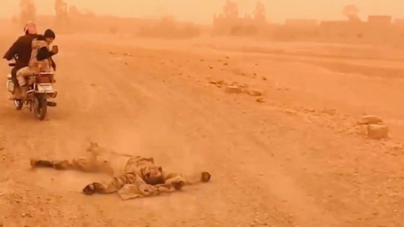 Accounts on TikTok posted videos of bodies being dragged through streets. Pictured here is a screenshot from an ISIS video posted last year. [ISIS]