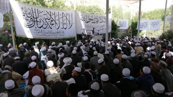 A Taliban spokesman seen here under armed guard as he speaks to members and civilians under the group's control in mid-August. [File]