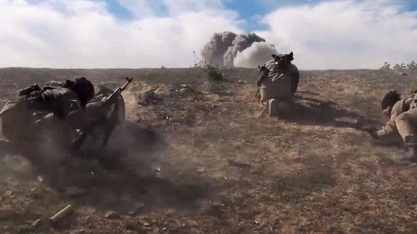 ISIS members seen here running for cover during anti-ISIS operations in Syria in 2018. [File]