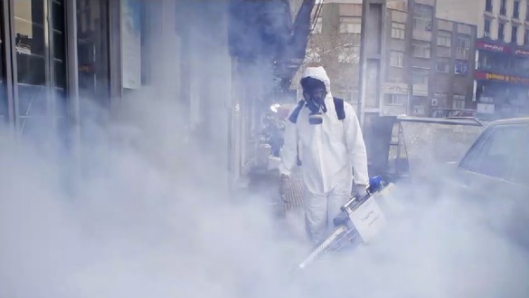 A worker fumigates streets in Tehran in mid-March in an attempt to slow the spread of the coronavirus pandemic that originated in China. [Asghar Khamseh/IRNA]