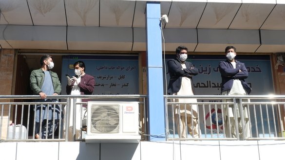 A number of Herat money exchangers can be seen in this photo taken March 8 as they wear masks to prevent the spread of the coronavirus. [Omar]