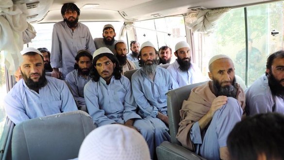 Taliban members leave prison on a bus in Parwan Province on May 25. The Afghan government has released about 1,000 Taliban prisoners across Afghanistan, with approximately 600 of them from the Bagram prison in Parwan Province. [Afghan National Security Council]