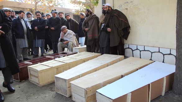 Kunduz residents last November 28 prepare to bury men, women and children who were killed after their vehicle struck a suspected Taliban roadside bomb in Imam Sahib District, Kunduz Province. [Hedayatullah]