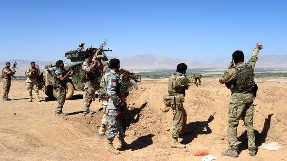 In this photograph taken on September 26, 2016, Afghan security personnel take part in an operation against Taliban militants in Garmaw Manda, Uruzgan Province. [Javed Tanveer/AFP]