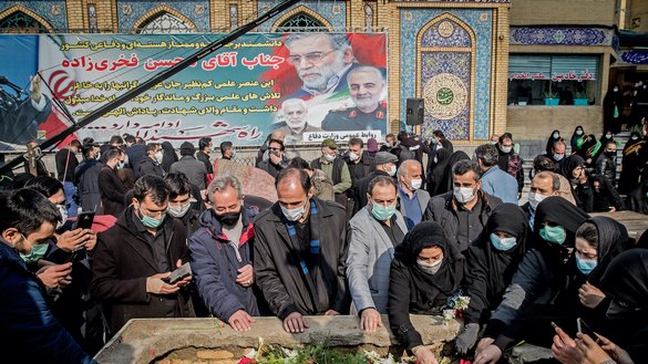 Mourners attend the burial ceremony of slain Iranian nuclear scientist Mohsen Fakhrizadeh at the Imamzadeh Saleh shrine in northern Tehran on November 30. [HAMED MALEKPOUR/TASNIM NEWS/AFP]