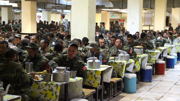 Afghan soldiers share an iftar meal April 17 at the compound of the 207th Zafar Corps in Herat province. [Omar/Salaam Times]