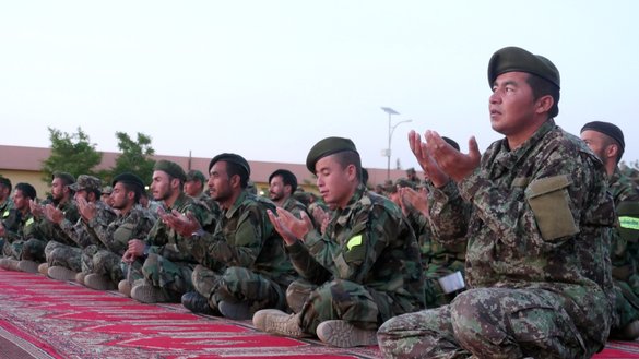 Afghan soldiers perform evening prayers April 17 at a mosque on the compound of the 207th Zafar Corps in Herat province. [Omar/Salaam Times]