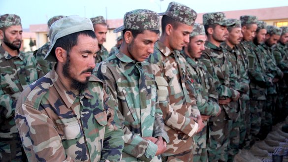 Afghan soldiers perform evening prayers in a mosque on the compound of the 207th Zafar Corps in Herat province April 17. [Omar/Salaam Times]