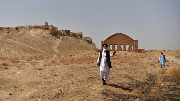Men walk at the historic fortress of Qala-e-Bost on the outskirts of Lashkargah, Helmand province, on March 27. [Wakil Kohsar/AFP]