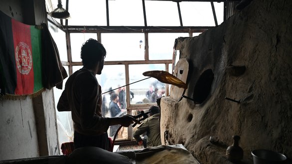 A baker works at a bakery in Kabul that is distributing free bread to some families as part of the Save Afghans From Hunger campaign, on January 18. [Wakil Kohsar/AFP]