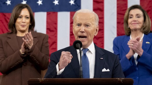 US President Joe Biden gestures, applauded by Vice President Kamala Harris (L) and House Speaker Nancy Pelosi, as he delivers his first State of the Union address in Washington, DC, on March 1. [Saul Loeb/Pool/AFP]