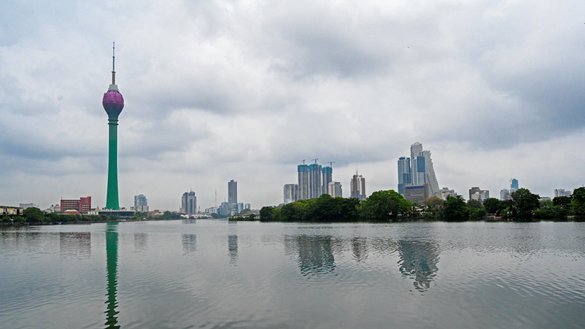 The Lotus Tower, a floral-shaped skyscraper bankrolled by Chinese funds, is pictured in Colombo, Sri Lanka, on May 5. The tower's colourful glass facade dominates the capital's skyline, but its interior has never been opened to the public. [Ishara S. Kodikara/AFP]