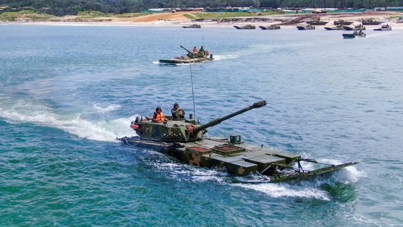 Chinese military personnel in June simulate an invasion using amphibious landing vehicles, which Beijing vows to use one day against Taiwan. [Chinese Ministry of Defence]