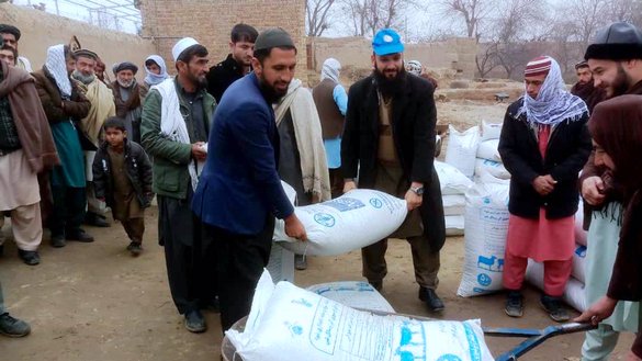 Livestock owners receive aid packages from donors in Kunduz city January 4. [Courtesy of Obaidullah Ahmadi]