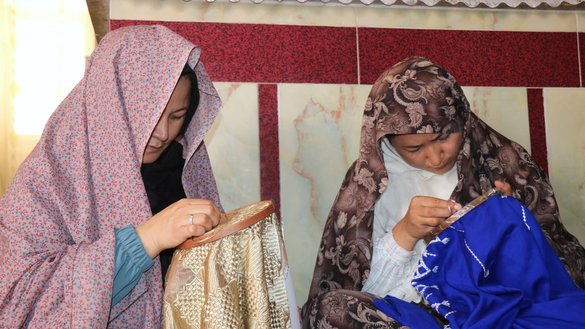 Two internally displaced women embroider at a UNHCR-supported workshop in Herat on July 22. [Omar/Salaam Times]