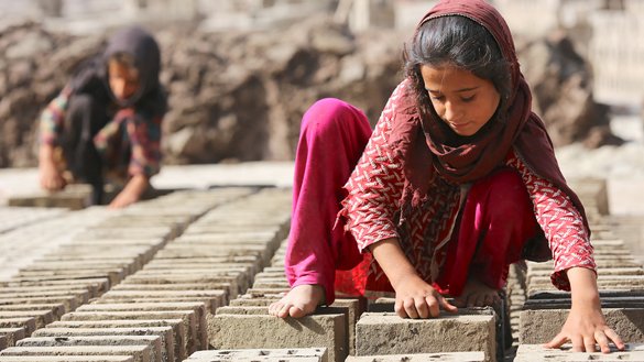Afghan girls work at a brick kiln in Surkh Rod district, Nangarhar province, June 13. Unable to go to school, many Afghan girls are forced to work or to marry young. Uneducated women raise uneducated children, repeating the cycle and increasing the risk of violence and extremism in society, activists warn. [Shafiullah Kakar/AFP]